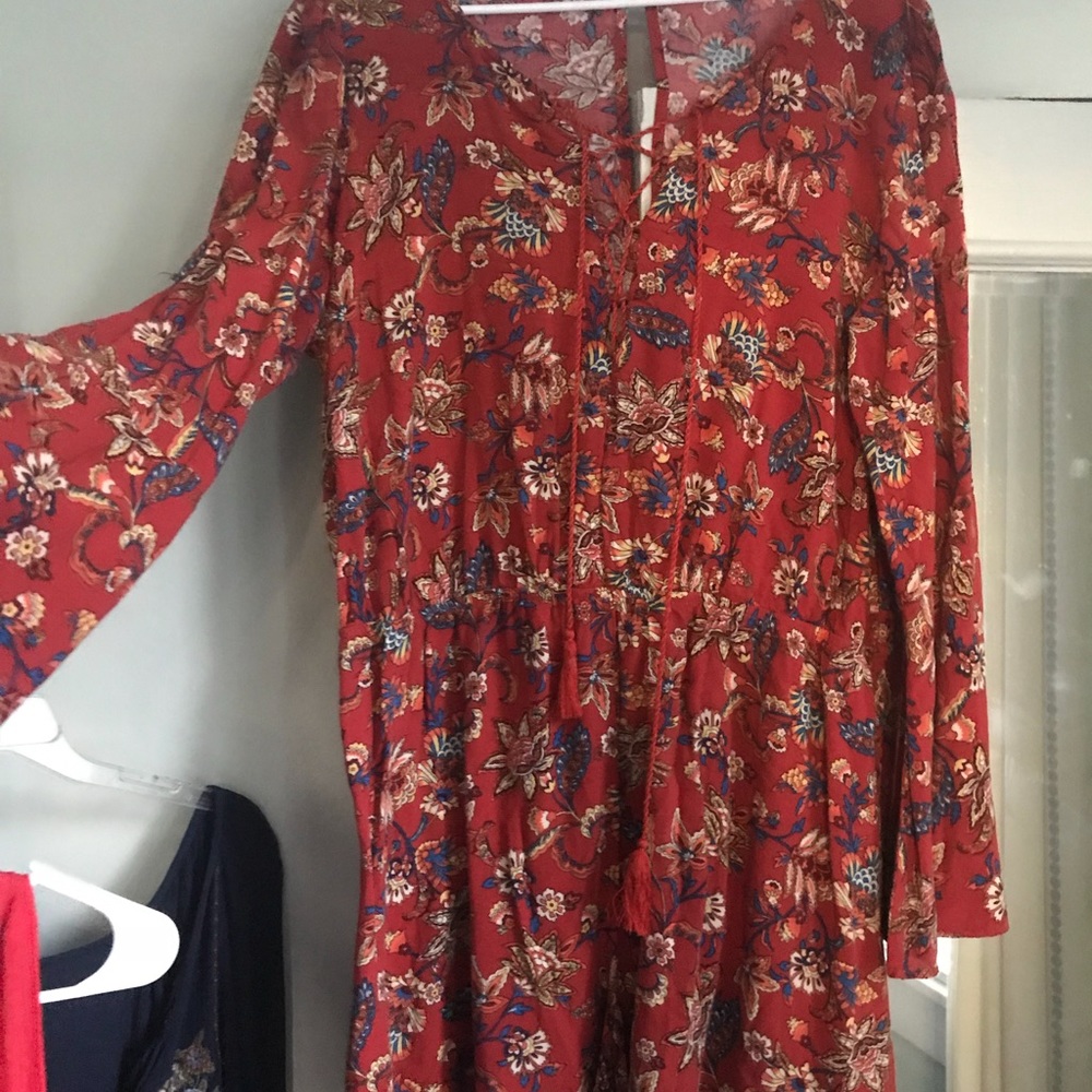 Red printed bell sleeve romper with lace up chest